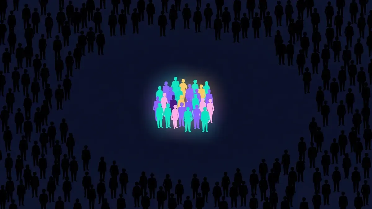 Large crowd silhouette with a small glowing group highlighted