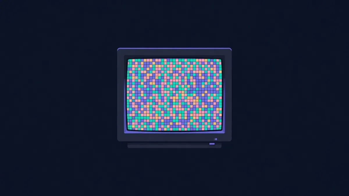 Old computer monitor showing a mosaic of tiny colorful pixel blocks